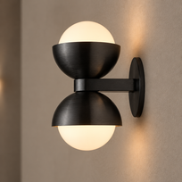 Black brass glass wall lamp close-up showing brushed metal and frosted glass