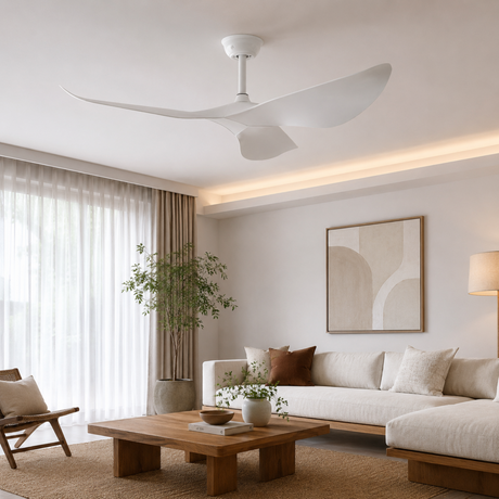 Modern living room with a ceiling fan, sofa, coffee table, and decorative elements.