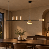 Cavelle natural stone five-head linear pendant in an evening wabi-sabi dining room