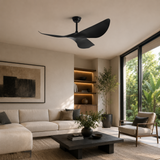 Modern living room with a black ceiling fan, beige sofa, and wooden armchair.