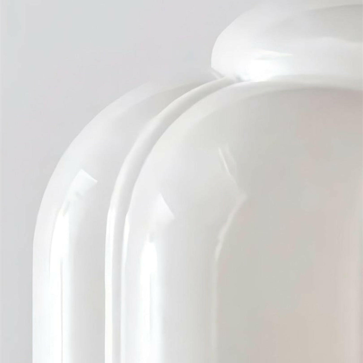 Close-up of a white ceramic plate on a light gray background