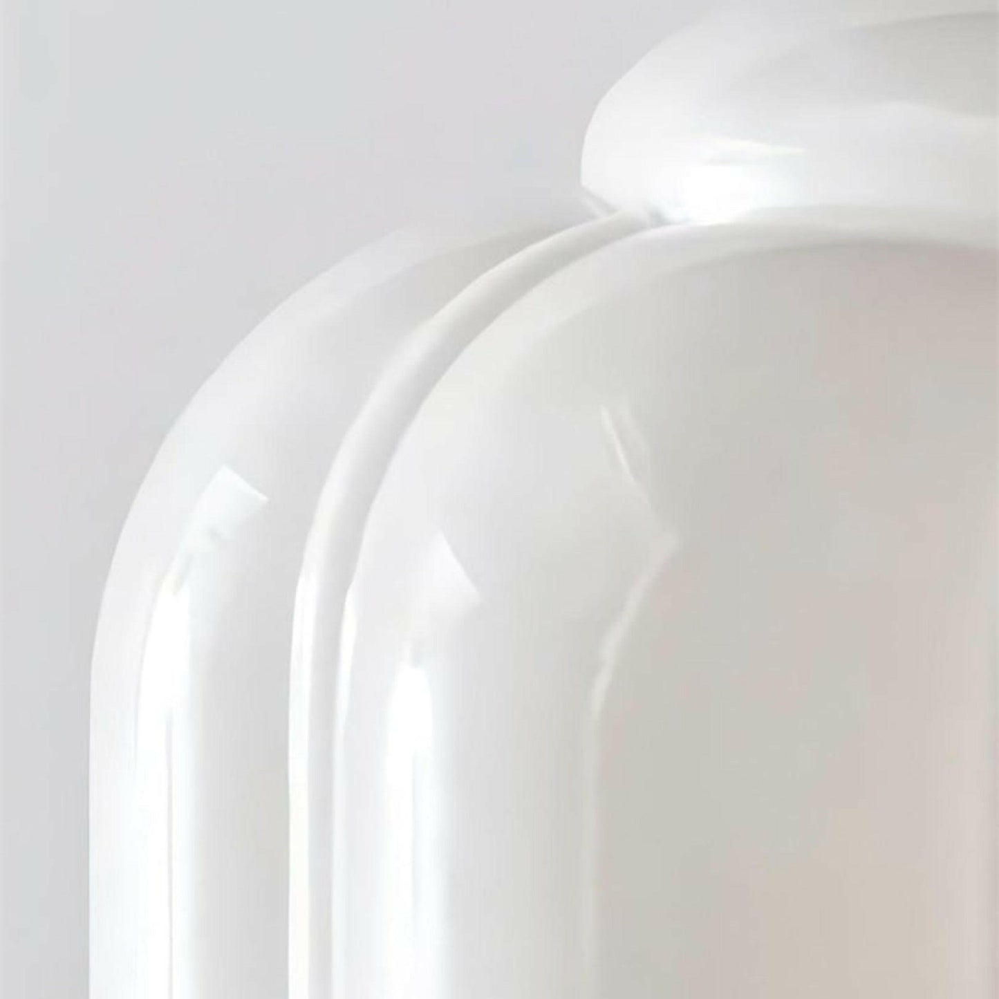 Close-up of a white ceramic plate on a light gray background