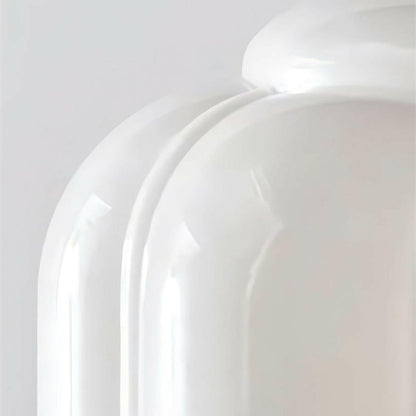 Close-up of a white ceramic plate on a light gray background