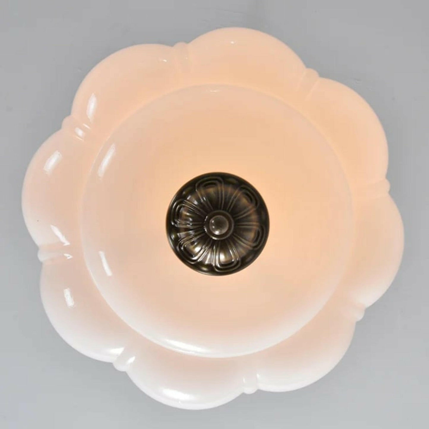Floral-patterned light fixture on a gray background
