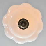 Floral-patterned light fixture on a gray background