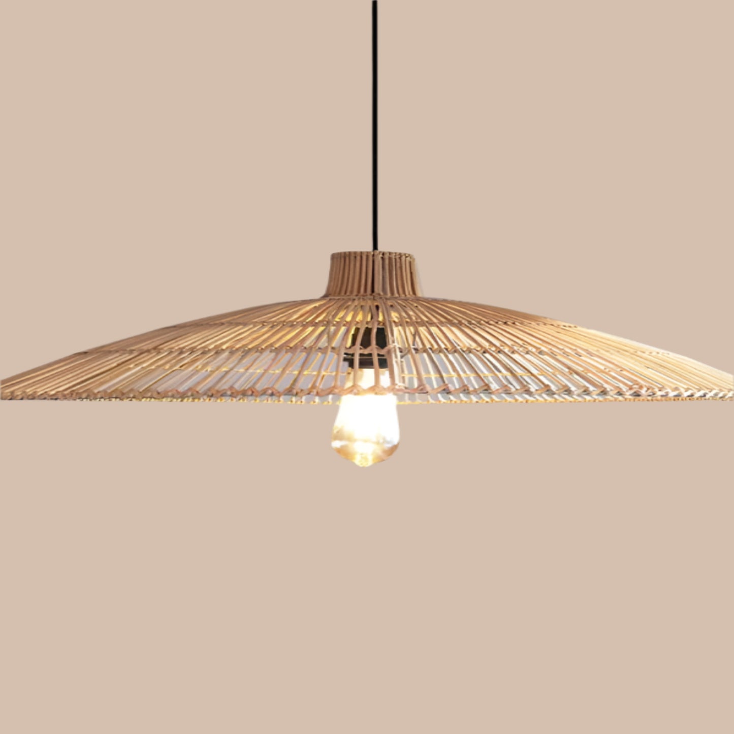 Woven pendant light with a bulb on a gray background