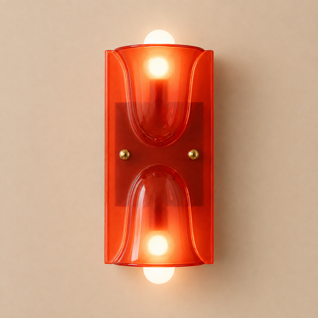 A modern wall-mounted light fixture with a translucent orange-red glass shade and two glowing warm white bulbs, centered against a plain beige wall.