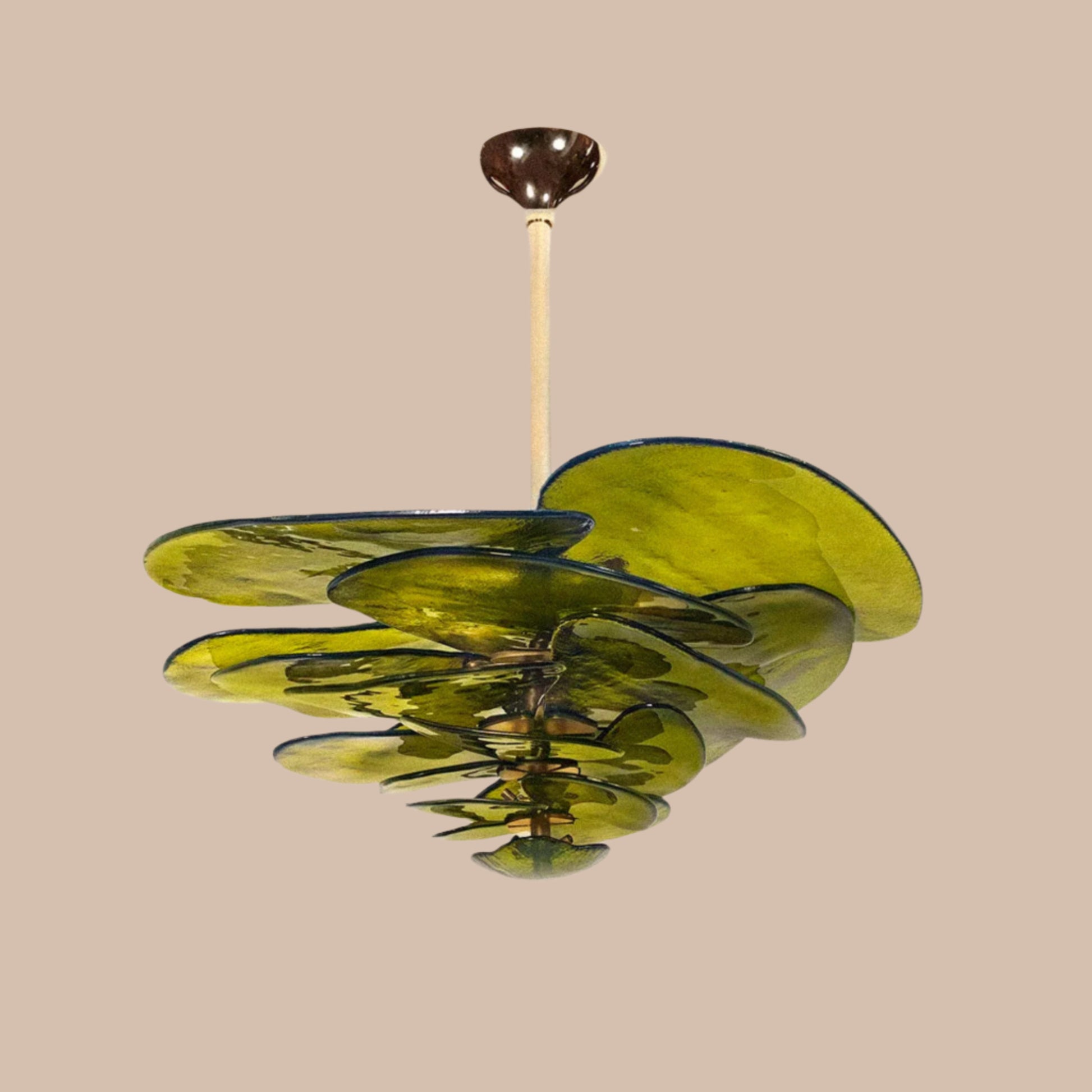 Green glass ceiling light fixture on a beige background