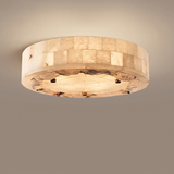 Natural marble ceiling lamp on a clean warm beige background