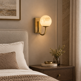 Natural alabaster globe wall light – bedroom bedside setting