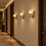 Natural alabaster globe wall light – three lamps in hotel corridor