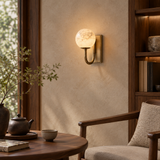 Natural alabaster globe wall light – warm tea room setting