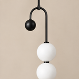 Noctis pendant matte-black metal and frosted shade close-up