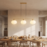 Nordic Linear Globe Chandelier – gold 3-head – dining-room lifestyle