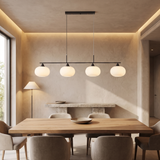 Nordic Linear Globe Chandelier – black 4-head – dining-room lifestyle
