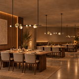 Orvella Linear Disc Chandelier – Black & Brass / 47.2 in (120 cm) – matching chandeliers over separate restaurant tables