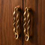 Ondara Wave Pull – Antique Bronze – Walnut cabinet lifestyle