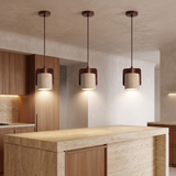 Three Orlena Cove pendant lights above a premium kitchen island