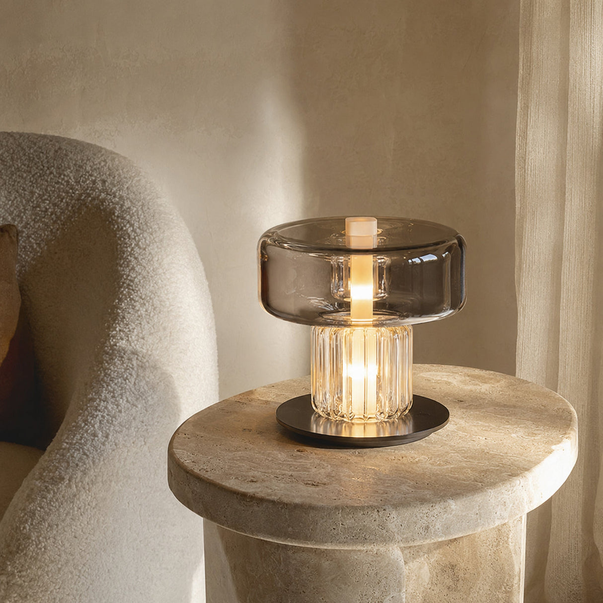 Small Postmodern glass desk lamp styled on a stone side table