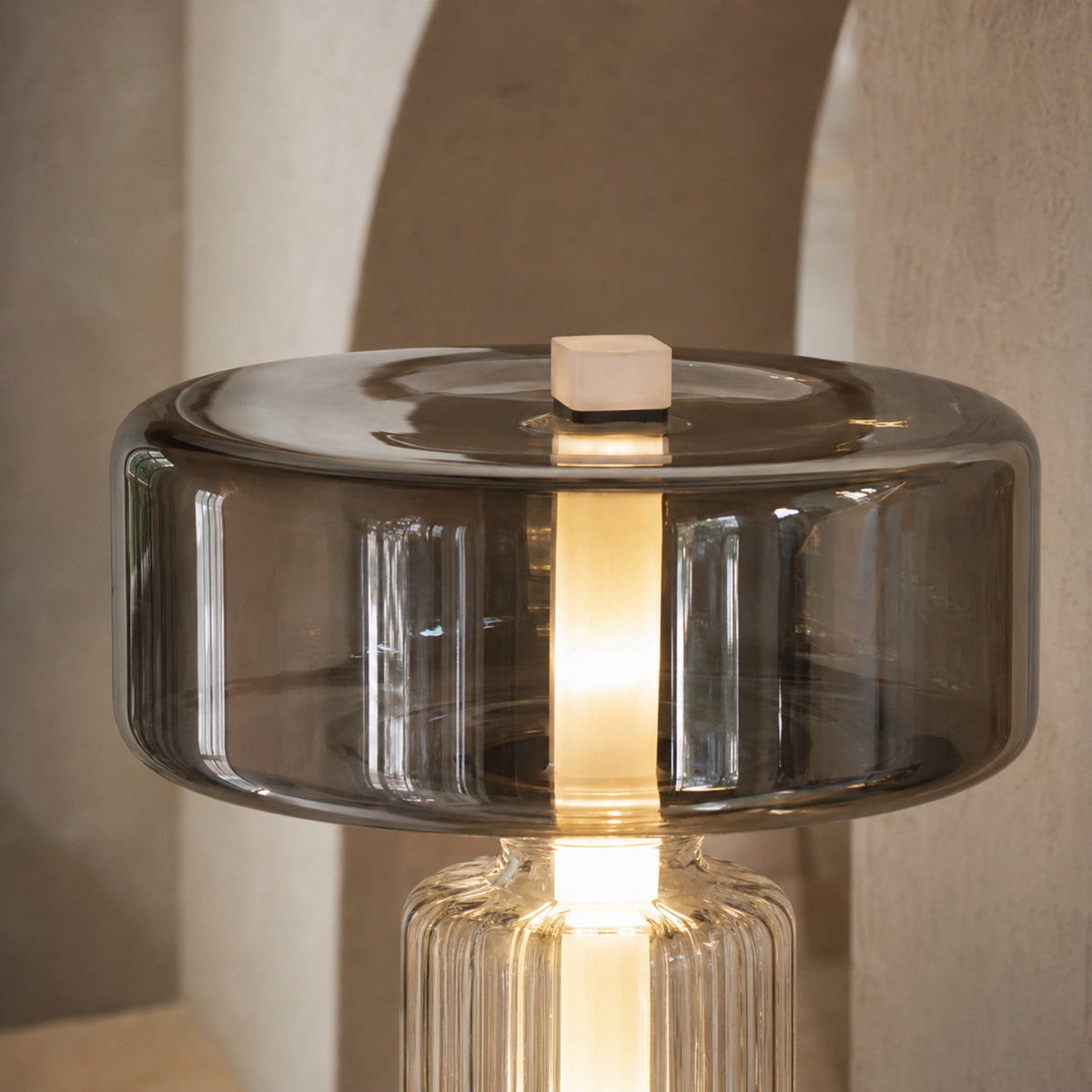 Close-up of the Postmodern lamp smoked glass shade and illuminated centre