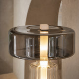 Close-up of the Postmodern lamp smoked glass shade and illuminated centre