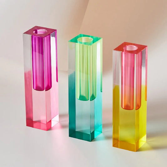 Three colorful rectangular vases on a light background