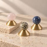 Solvi Brass Ball Cabinet Knobs – Blush Pink, Spotted and Blue Veined – Studio arrangement on natural stone