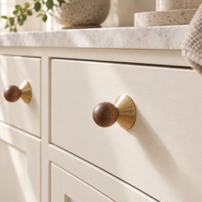 Solvi Brass Ball Cabinet Knobs - Walnut Wood - Lifestyle on cream cabinetry