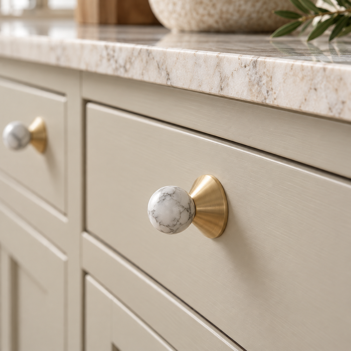 Solvi Brass Ball Cabinet Knobs - White Veined - Lifestyle on greige cabinetry