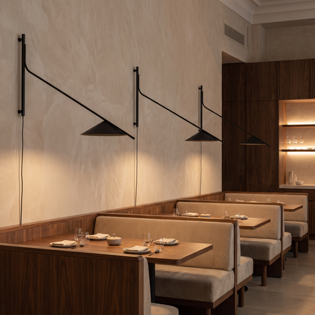 Multiple Soren Reach adjustable wall lamps in a restaurant