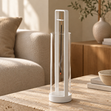 White upside-down incense holder with clear glass ash catcher in a warm Japandi living room