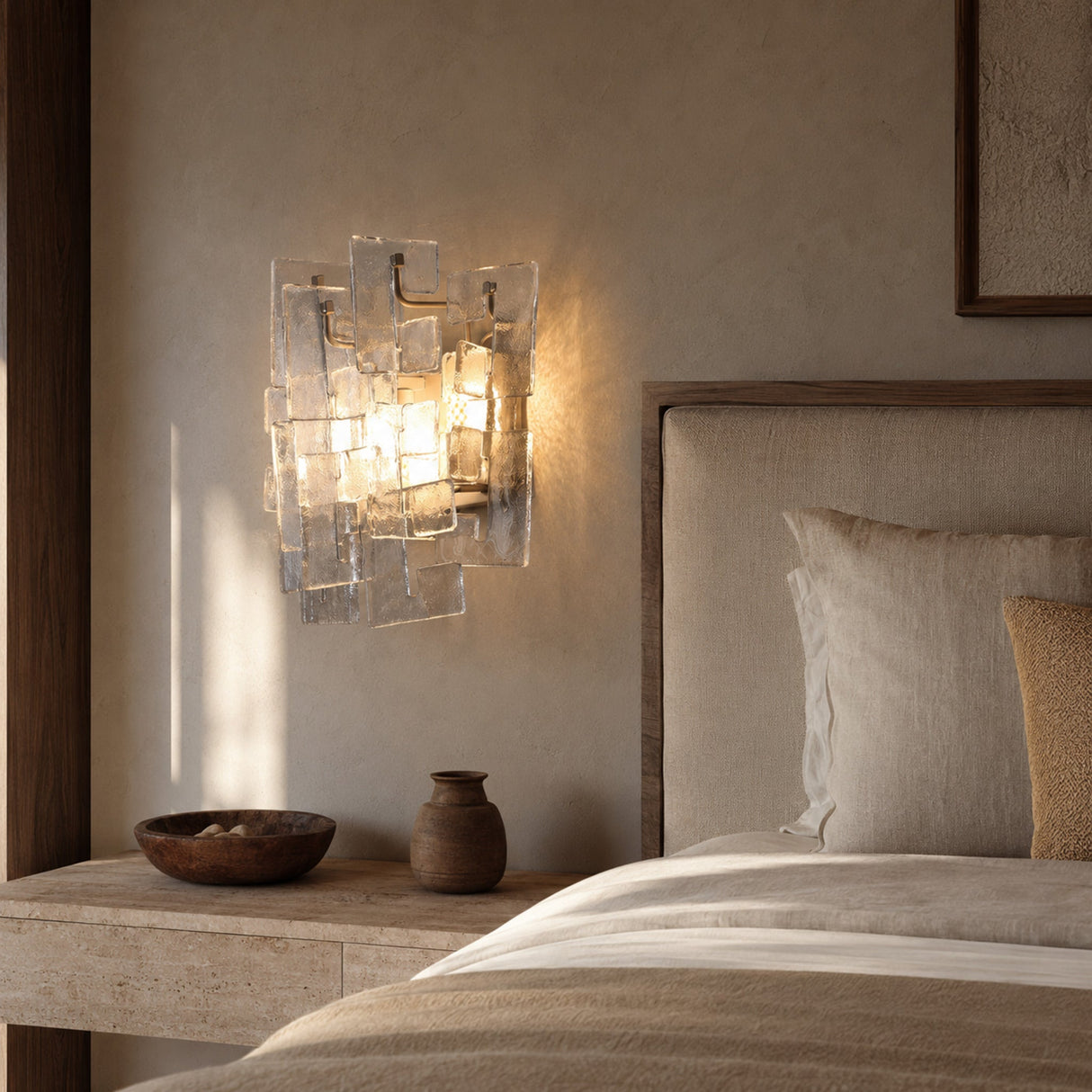 Vintage Medieval transparent glass wall lamp installed beside a luxury bed