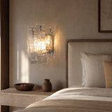 Vintage Medieval transparent glass wall lamp installed beside a luxury bed