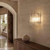 Vintage Medieval transparent glass wall lamp in a warm architectural hallway